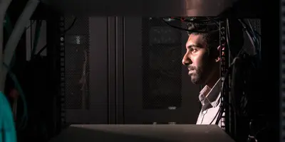 Male working at a data center